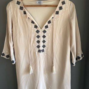 Cream colored tunic with navy and white embroidery